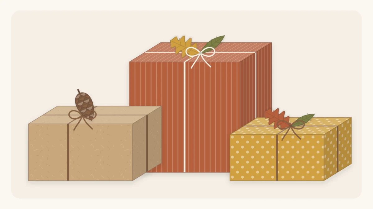 Three gifts in kraft, rust and deep mustard paper tied with twine, topped with paper leaves and a small pinecone