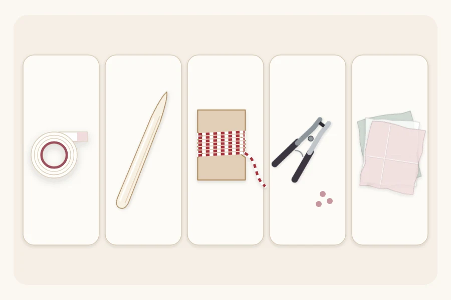 Double-sided tape, a bone folder, twine on a card, a hole punch and tissue paper