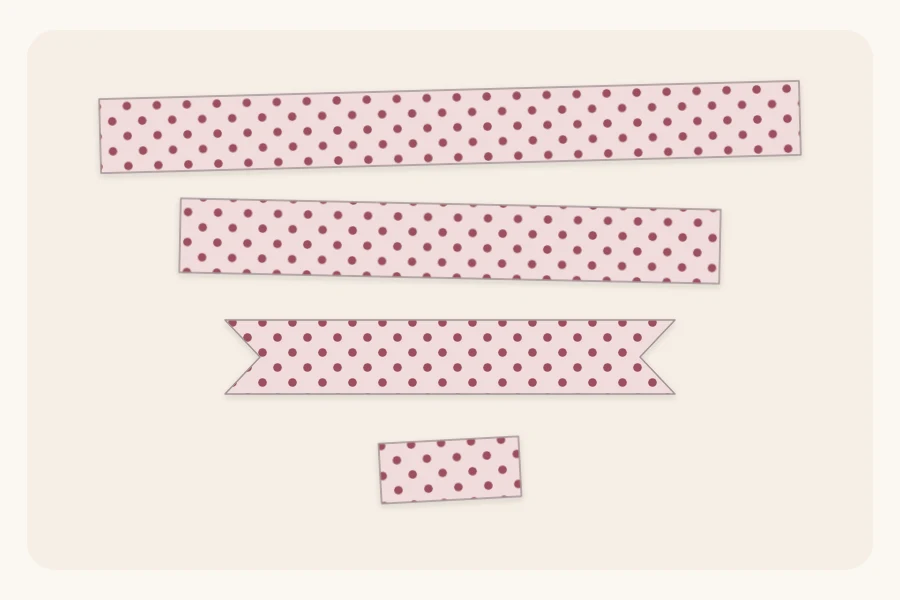 Cut pieces of a paper bow: long loop strip, shorter notched tail strip and small center band