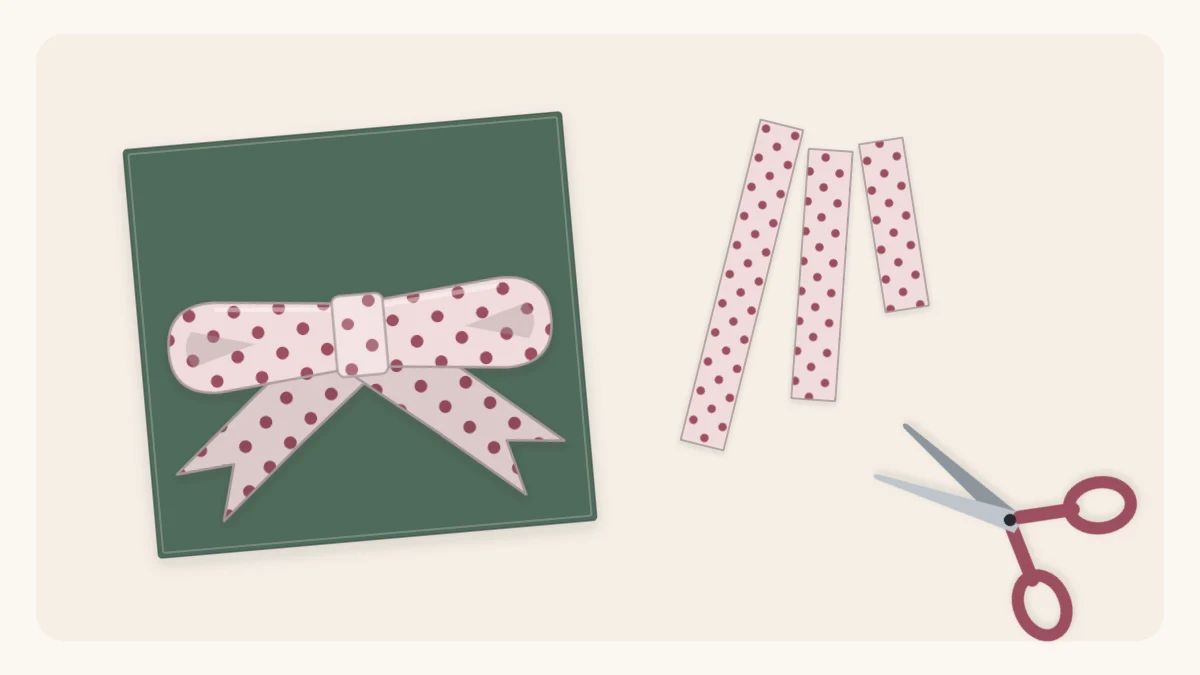 A flat paper bow made from dotted wrapping paper on a wrapped gift with paper strips and scissors