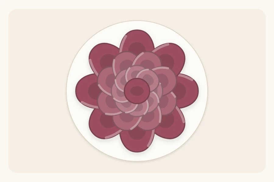 A finished layered ribbon bow from above with loops fanned in a circle and a small center loop