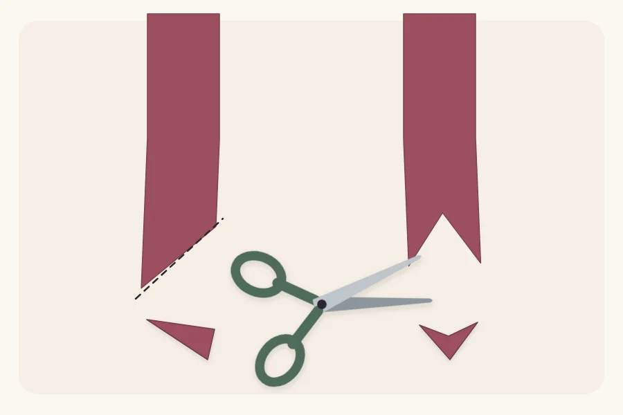 Two ribbon tails, one cut on a diagonal and one in a V notch, with scissors