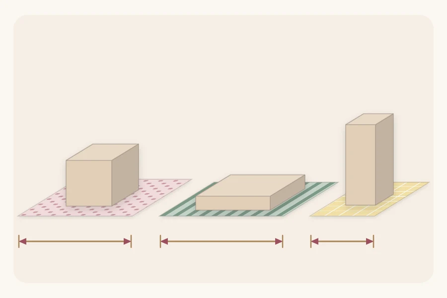 A cube, a flat shirt box and a tall box, each on its own cut sheet of paper