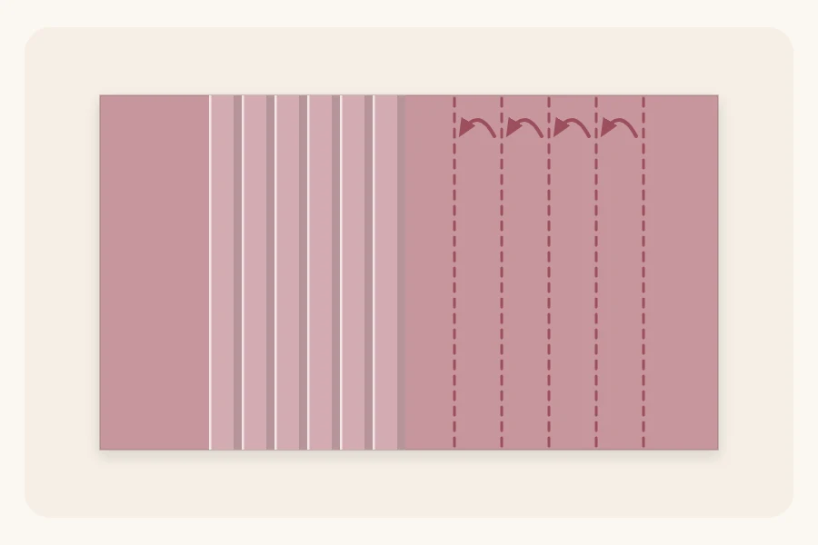 A sheet of paper with a row of evenly spaced pleats folded into one section