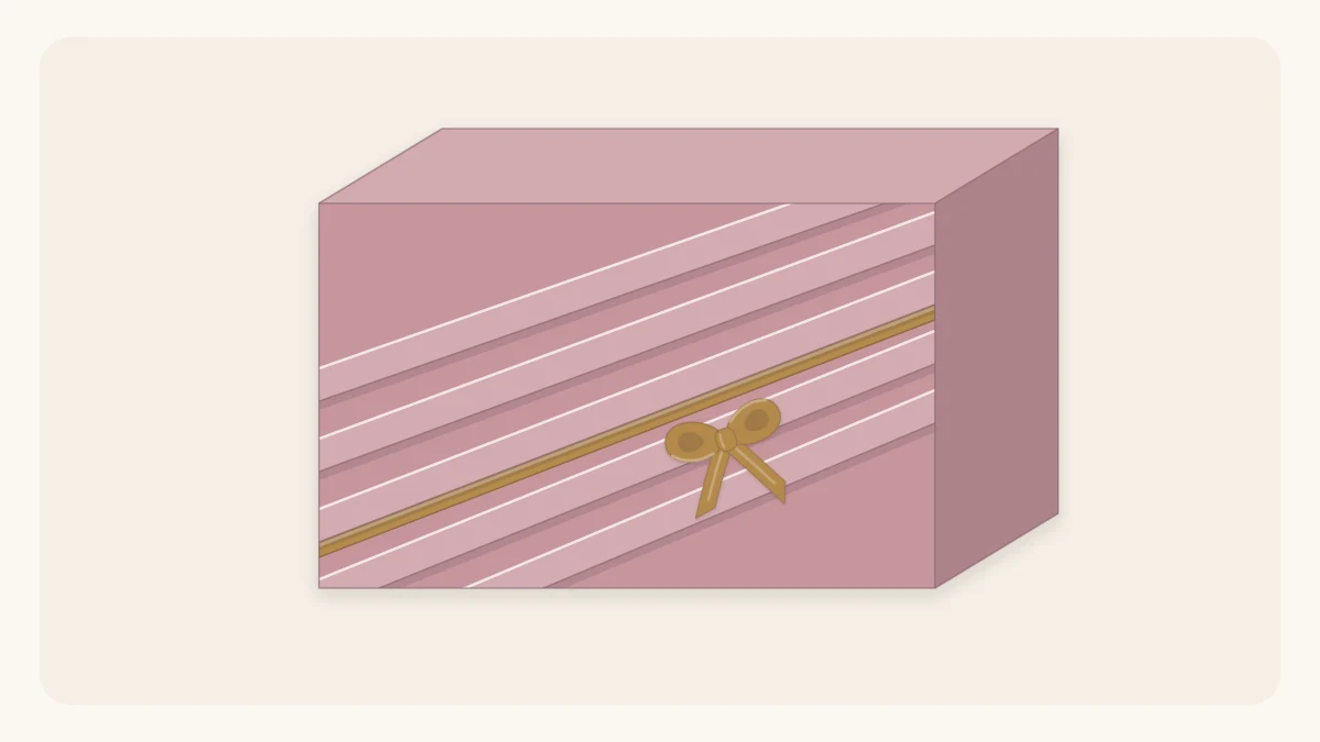 A box in dusty-rose paper with five diagonal pleats and a thin ribbon tucked into one pleat