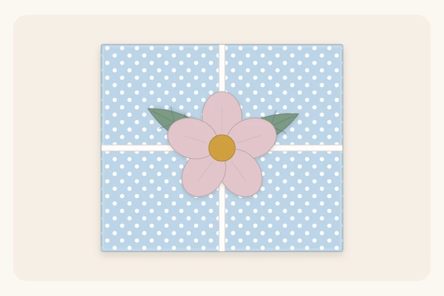 A pastel-wrapped box topped with a simple five-petal paper flower and two paper leaves