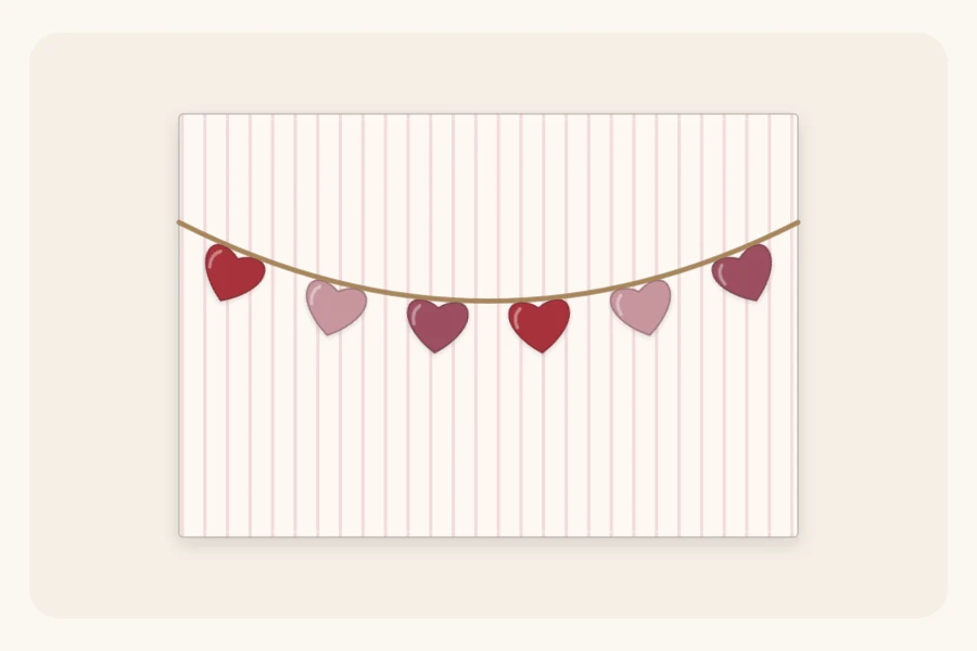 A wrapped box with a row of small cut-paper hearts strung on twine across the top