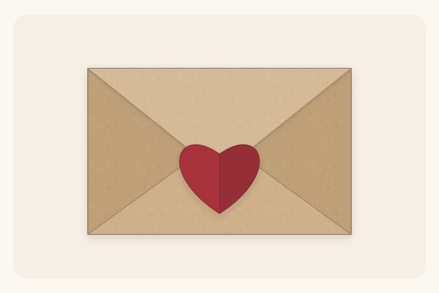 A folded paper heart sealing the flap of a small kraft envelope-style wrap